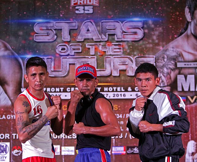 From left: Visiting boxers Tony Rodriguez, Yesner  Talavera and Eduardo Montoya face the crowd in a public workout at the SM City Cebu Event Center. (CDN PHOTO/LITO TECSON)