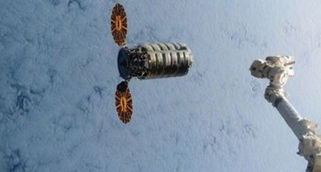 This still image taken from NASA TV shows acommercial cargo ship named Cygnus about to connect to the International Space Station on Saturday, March 26, 2016.  It's the first of three shipments coming up in quick succession. A Russian cargo ship will lift off in a few days, followed by a SpaceX supply run on April 8. NASA has turned to private industry to keep the space station stocked.   (NASA via AP)