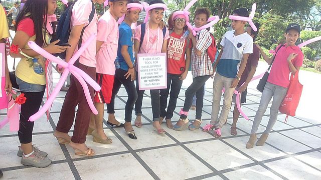 Male participants wear heels during the In Her Shoes event spearheaded by the National Youth Commission to promote women empowerment and equality. (Photo contributed by Sheridan Gajete)