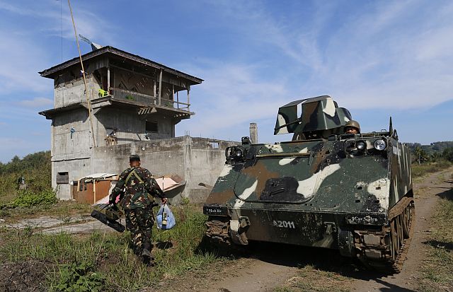 Government troops go inside the recaptured territory  in Butig, Lanao del Sur after their successful operation against Jemaah Islamiyah-affiliated Maute group. (INQUIRER)