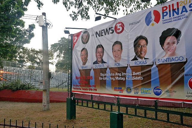 UP PREPARATION FOR PRESIDENTIAL DEBATE/MARCH 10, 2016: A lardge billboard with the faces of the five presidential candidates were already displayed infront of the University of the Philippine (UP) Cebu campuz ground where bleachers (left) is being set up in preparation for the 2nd Presidential debate this coming March 20, 2016. PNP will emplement a tight security and portion of Gorrordo Ave. will be close to traffic.(CDN PHOTO/JUNJIE MENDOZA)