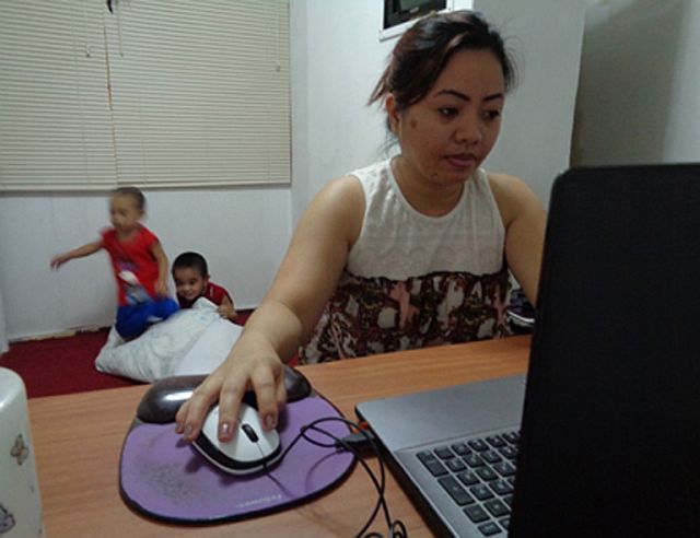 Working from home is challenging but Aying, 34, is used to the distrctions that sometimes come from her energetic sons. (CONTRIBUTED PHOTO/FRAULINE MARIA SINSON)