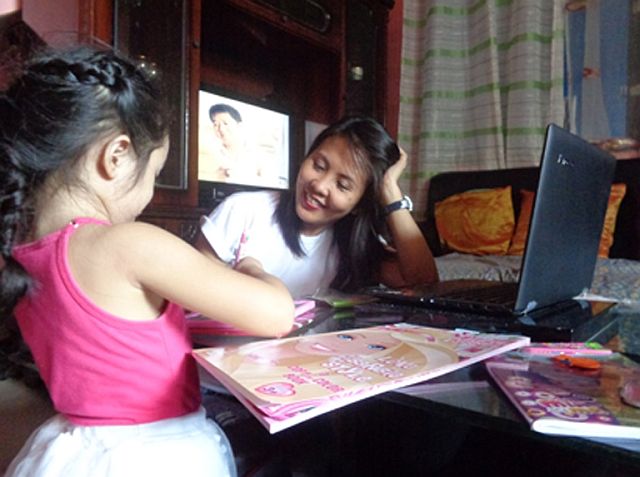 Since quitting her regular job, Marnie May Tamag, 34, has been a full-time mother to her two kids (her eldest daughter in the picture) as well as a full-time virtual assistant to her online clients. (CONTRIBUTED PHOTO/FRAULINE MARIA SINSON)