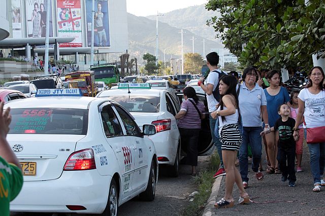 Taxi cabs continuous to arrive and pick up passengers visited the newly open SM City Seaside at the South Road Properties (SRP) (CDN FILE PHOTO)