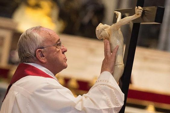 Pope Francis venerates the holy cross with the image of the crucified Jesus Christ. (L'Osservatore Romano)