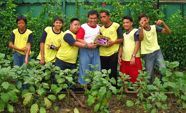 Children with mental disabilities are taught gardening at the Adam Jennie's Christian Center for Special Children. After months of toil, they reap the harvest they sow. (CONTIBUTED PHOTO)