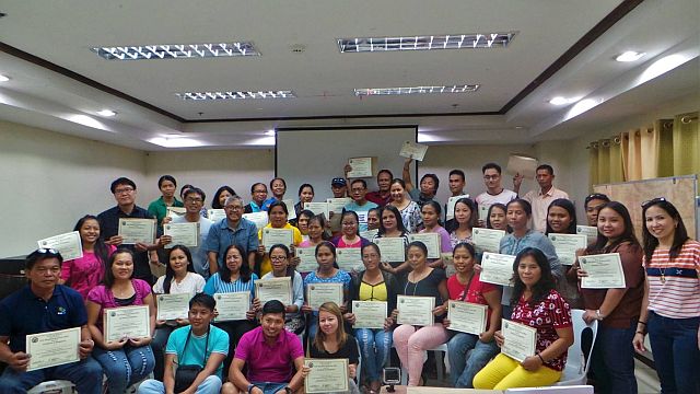 Participants of the trainer’s training and workshop on community-based ecotourism receive their certificates of attendance. (CONTRIBUTED)