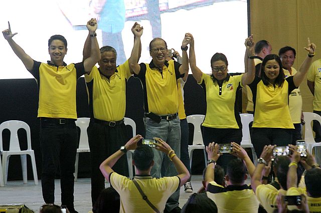 LP RALLY IN ARGAO/APRIL 18, 2016: President Benigno Aquino III (center) with Paolo Roxas (left) son of LP standard berear Mar Roxas and Jessica marie"Aika" Robredo (right) daugther of LP vice presidential candidate Line Robredo rais the hands of Cebu governor Hilario Davide III and vice governor Agnes Magpale during the LP rally in Secretary Cerge M. Remonde Sports and Cultural center in Argao Town.(CDN PHOTO/JUNJIE MENDOZA)