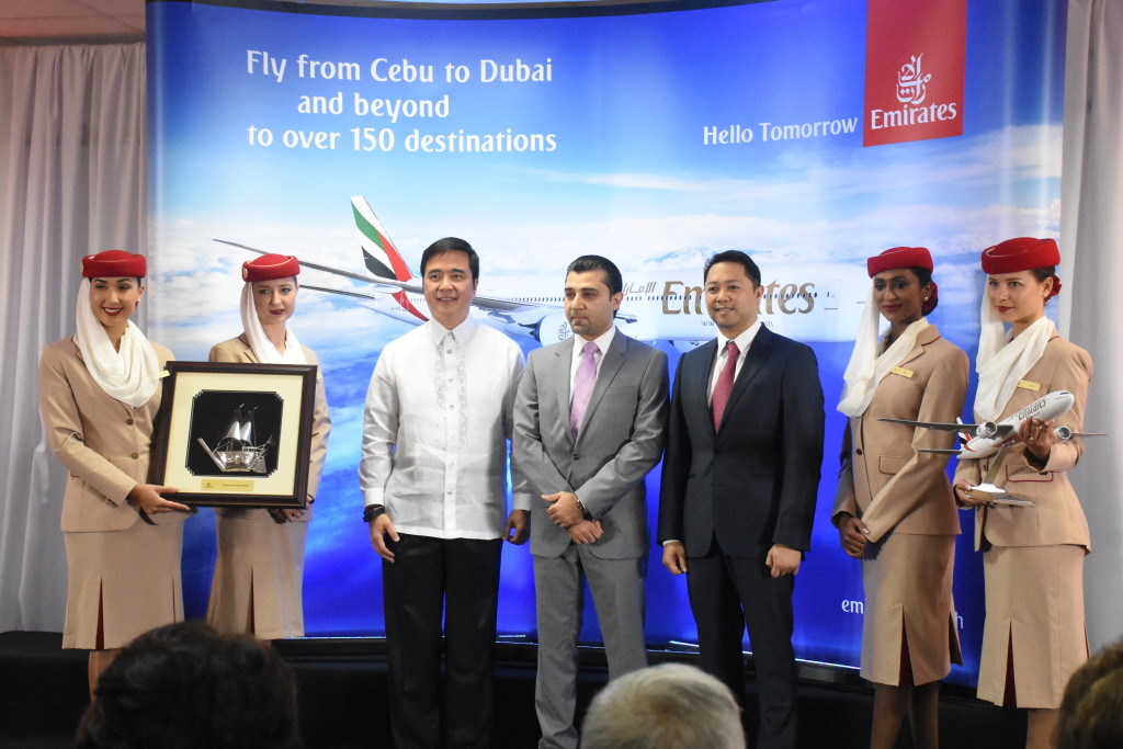 GMR-MEGAWIDE Cebu Airport Corp. President Manuel Louie Ferrer (fifth from left) is joined by Transportation Secretary Joseph Abaya (third from left) and Badr Abbas, Emirates' senior vice president for Commercial Operations - Far East along with Emirates Flight Attendants as the airline company presents their token to GMCAC and DOTC.