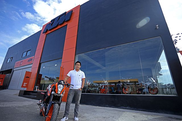 KTM MOTORCYCLE/APRIL 04,2016:Brian Lacson of KTM Visayas Corporation pose one of his KTM display.(CDN PHOTO/LITO TECSON)