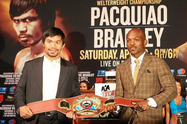 Manny Pacquiao and Timothy Bradley Jr. holds the WBO Welterweight champinoship "legacy" belt during the final press conference at the David Copperfield Theater inside MGM Hotel in Las Vegas, April 6, 2016. Pacquiao and Bradley is set to fight on Saturday (Sunday Philippine time.)     PHOTO BY REM ZAMORA