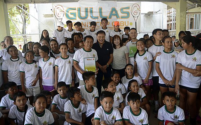 Organizers and participants of the JRG Gullas Tennis Cup gather before the start of the tournament at the Consolacion Tennis Club in Consolacion town, north Cebu. (CDN PHOTO/CHRISTIAN MANINGO)