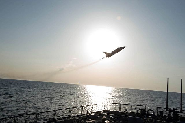 A Russian Sukhoi Su-24 attack aircraft makes a low altitude pass by the USS Donald Cook in the Baltic Sea. (AP)