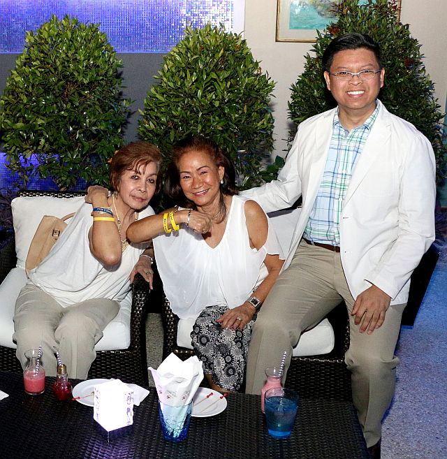 Chinggay Utzurrum  and Aissa dela Cruz  with Jude Pangan,  reservations manager