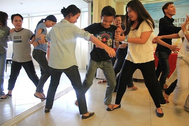 OWWA scholars perform an activity that tests their camaraderie and cooperation during the personality enhancement training at The Well Hotel in Cebu City. (CONTRIBUTED)