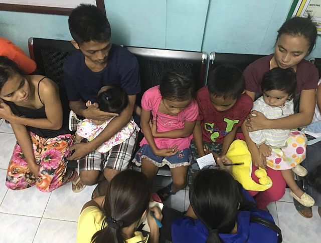 Some of the seven young children of ambushed victim Rene Cangmaong brought to safety to the town hall. (CDN PHOTO/TONEE DESPOJO)