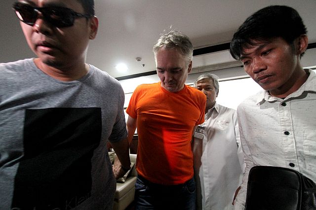 NBI arrests Dutch national Martin De Fong on an operation in Makati for selling cookie monster ecstasy. (INQUIRER)