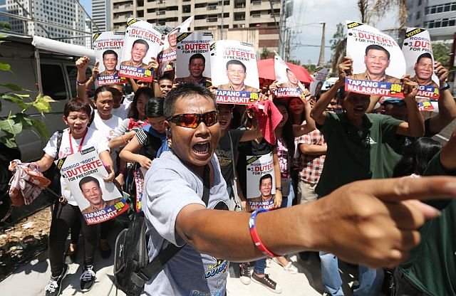 May 2, 2016 Supporters of both Davao Mayor Rodrigo Duterte  troop the BPI office in Julia Vargas St. Pasig City after Duterte's lawyer and Trillianes faced off to settle the alleged  P211 million pesos Duterte account . INQUIRER/ MARIANNE BERMUDEZ
