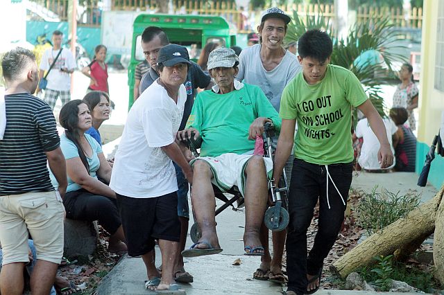 GABI CORDOVA SPECIAL ELECTION/MAY 14, 2016 Felipe Pogoy 60 years old a resident of sitio Mahayahay, Gabi, Cordova was carried by his family going to the polling place at Gabi Elementary school to cast votes despite his physical condition.(CDN PHOTO/FERDINAND EDRALIN)