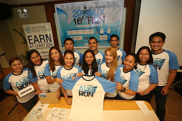 Organizers of the 2016 AUX Run show the race’s official singlet during the run’s launching yesterday  at the Montebello Villa Hotel in Banilad. (CDN PHOTO/LITO TECSON)