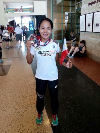 HELLO, RIO. Mary Joy Tabal from Cebu shows off her finisher’s medal after her stint in the Scotiabank Ottawa Marathon in Canada last Sunday. (CONTRIBUTED)