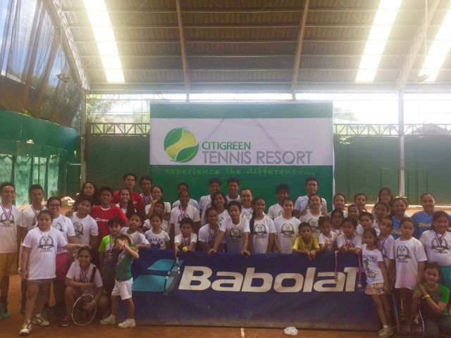 Participants and coaches of the CitiGreen Tennis Clinic gather during the last day of the camp. (CONTRIBUTED)