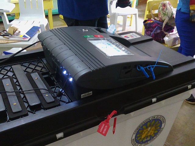 This Vote Counting Machine (VCM) in one of the precints in Tuburan bogged down. (CDN PHOTO/VICTOR ANTHONY V. SILVA)