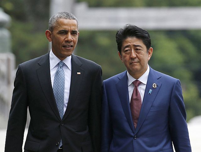 US President Barack Obama (left) talks with Japan's Prime Minister Shinzo Abe on the Ujibashi bridge as they visit the Ise Jingu shrine in Ise, Mie prefecture, Japan on Thursday. (AP)