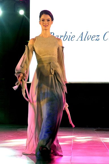 ROMANTICISM. Barbie Alvez cold shoulder dress detailed with ribbons.