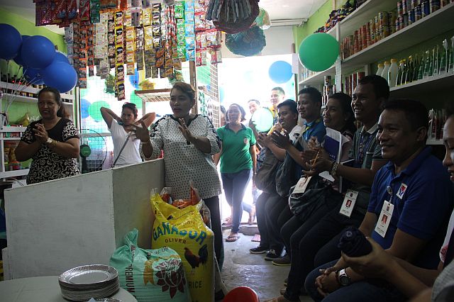 Cordova municipal social welfare officer Josefina Montebon (center) encourages the beneficiaries to sell products that are in demand in the area to sustain the store's operation. (CONTRIBUTED)