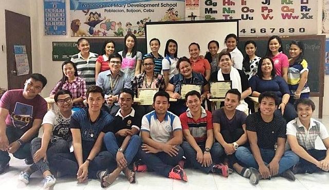 Teaching personnel of Patronage of Mary Development School in Boljoon town, southern Cebu pose with the speakers during the in-service training. (CONTRIBUTED)