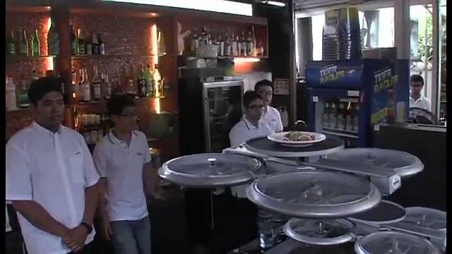 A drone waiter flies dirty dishes from a customer’s table in a restaurant in Singapore. (YOUTUBE GRAB)