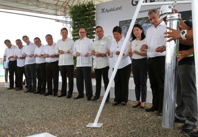 Andoni Aboitiz (fourth from left), AboitizLand president and chief executive officer, leads government, AyalaLand, and AboitizLand officials during the June 6, 2016 lowering of the time capsule of the Gatewalk Central project in Barangay Subangdaku, Mandaue City. The event is part of the groundbreaking  activities of the 17.5-hectare mixed-use project. (CDN PHOTO/JUNJIE MENDOZA)