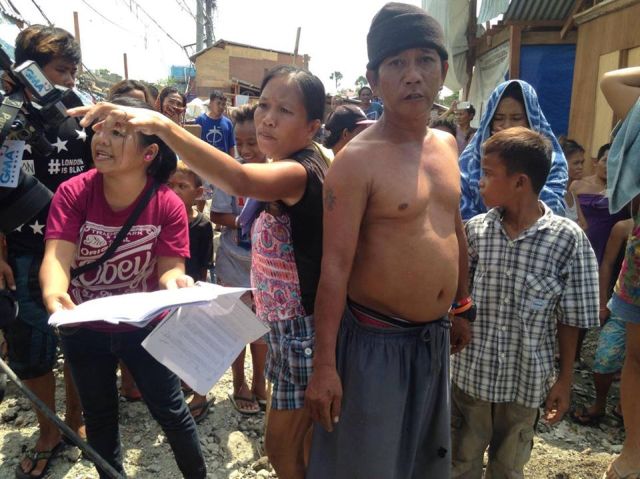 Residents complain of the clearing operation at the fire site in Barangay Guizo, Mandaue City saying the city needs to secure a court order as the lot was already donated to them. (CDN PHOTO/JULIT JAINAR)