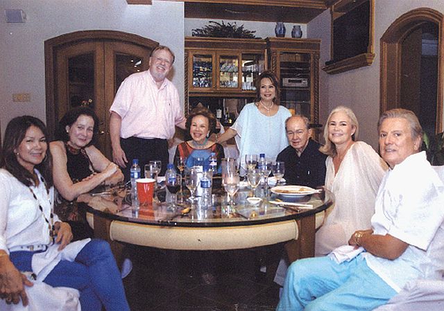 Peter and Hermie Cullen  (standing) with well-wishers,  seated from left Rose Hennessy,  Susan Sala, Rosebud Sala,  me, UK honorary consul Tamsin Booth and Garrison Rosseau