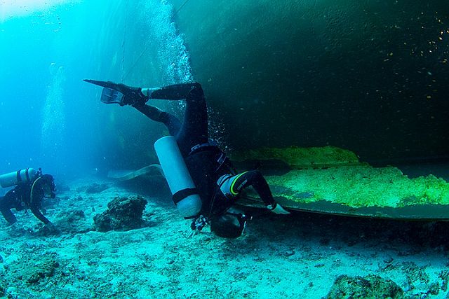 A diver checks on the base portion of MV Belle Rose which ran aground in Monad Shoal Sunday last week. (CDN PHOTO/FERDINAND EDRALIN)