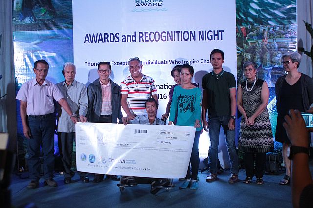 Norman Pagal of Barangay Anapog, San Remigio, Cebu recieves the Ocean Heroes Award  initiated by Oceana Philippines. This is in line with the protection of the Tañon Strait. (CDN PHOTO/FERDINAND EDRALIN)