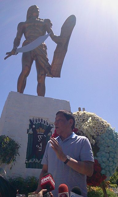 Duterte and Cayetano offered flowers to the monument of Lapu-Lapu at the Mactan Shrine and spoke to employees of MEPZ.(CDN PHOTO/NORMAN MENDOZA)