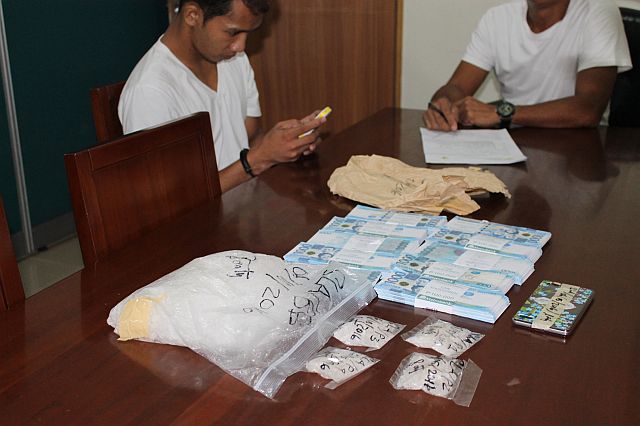 Jovannie Quirante Llego (left photo) is escorted to the Philippine Drug Enforcement Agency Central Visayas (PDEA-7) headquarters after he was arrested in a buy-bust operation. Above, Llego and the suspected shabu, cash and drug paraphernalia confiscated from the suspect are presented to the media during a press briefing at the PDEA-7 office. (CONTRIBUTED PHOTO)