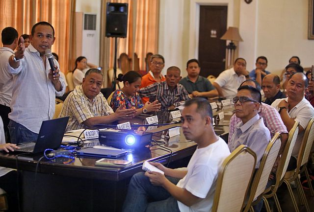 Lawyer Baltazar Tribunalo, Provincial Disaster Risk Reduction and Management Office (PRRRMO) head, (left with microphone) explains the Monad Shoal situation to Cebu Gov. Hilario Davide III (second from left) and  representatives of government agencies and environmental groups during an emergency meeting at the Capitol. (CDN PHOTO/LITO TECSON)