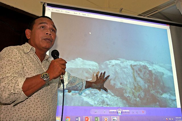 Capitol disaster management council chief Baltazar Tribunalo shows the extent of damage caused by the MV Belle Rose. (CDN FILE PHOTO)
