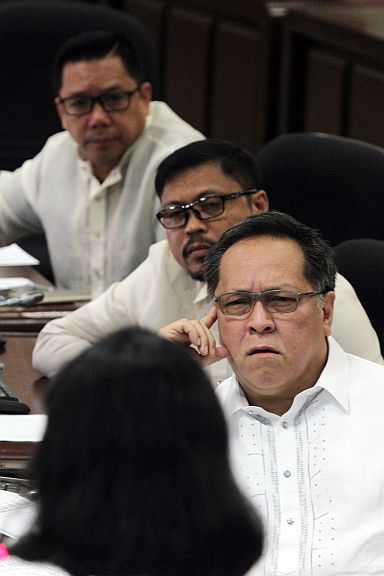 Cebu City Councilors James Cuenco, Philip Zafra and Richard Osmeña listen to Marietta Gumia (back to camera) of the City Budget office who explains the appropriations contained in the proposed 2016 budget during the budget hearing held right after the  regular session. (CDN PHOTO/JUNJIE MENDOZA)