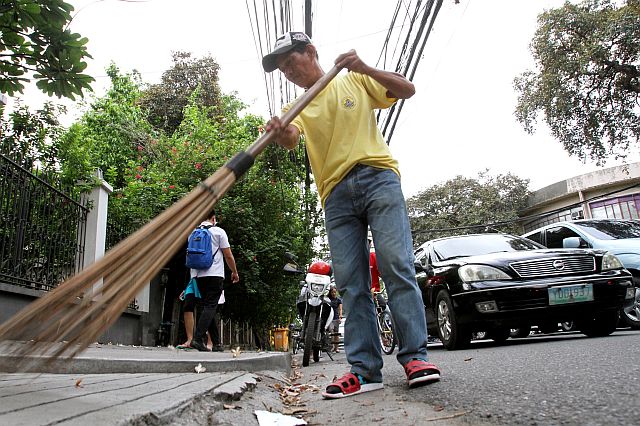 Eduardo Opinio, 50, a street sweeper, fears losing his job of 16 years as he is among the 3,400 Cebu City casual employees whose employment contract might not be renewed after June 30. (CDN PHOTO/JUNJIE MENDOZA)