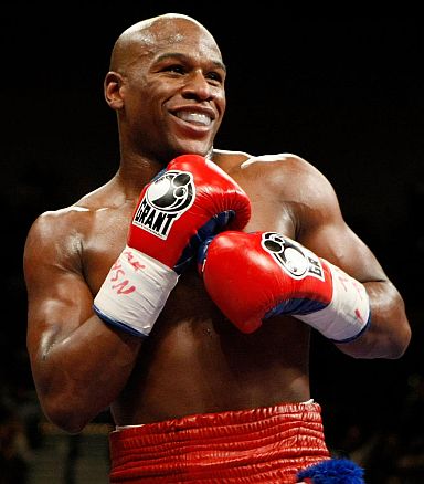 TO GO WITH AFP STORY Floyd Mayweather Jr. smiles in the ring during his fight against Juan Manuel Marquez at the MGM Grand Garden Arena September 19, 2009 in Las Vegas, Nevada. Mayweather won by unanimous decision.   Ethan Miller/Getty Images/AFP (Photo credit should read Ethan Miller/AFP/Getty Images)