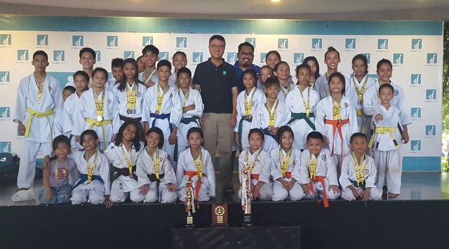 Team Hayashi-ha Shitoryukai karatekas pose with their gold medals together with Insular Square owner Michael Lim and the team’s sensei Reynante Vidal. (CONTRIBUTED PHOTO)  