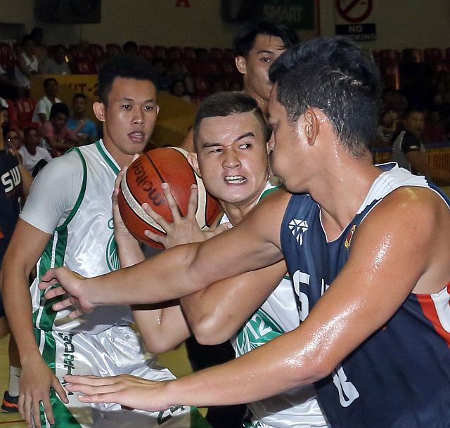 Players from Worthy-UV and Phinma-SWU battle it out in their last meeting at the Cebu Coliseum. (CDN PHOTO/LITO TECSON)