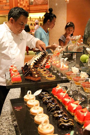 Feria Executive Pastry Chef Edgar Daclan manning the dessert station