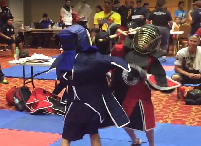 Two young arnisadors battle it out at the 14th Wekaf World Championships at JCentre Mall in Mandaue City.