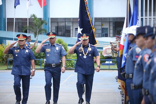 PNP Chief Dir. Gen. Ronald "Bato" Dela Rosa (right) salutes as he marches pass police personnel at the PRO7. (CDN PHOTO/LITO TECSON)