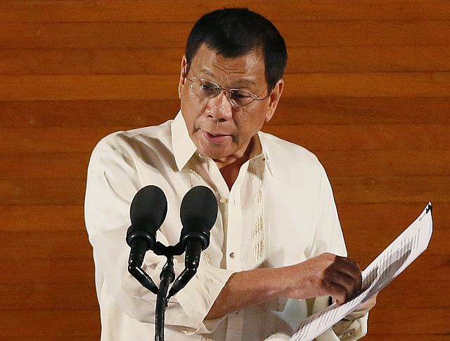 Philippine President Rodrigo Duterte delivers his first State of the Nation Address (SONA) before the joint session of the 17th Congress Monday, July 25, 2016, at suburban Quezon city northeast of Manila, Philippines. (AP Photo/Bullit Marquez)